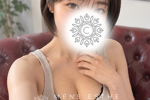 Model seated on a red tufted couch in a beige tank top; face obscured by a decorative logo, with 'MEN'S ESHE CIELO' text overlaid.