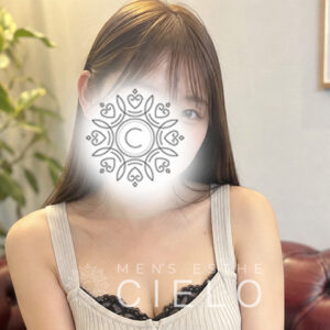 横浜センター南メンズエステCIELO | センター南シエロ Woman in a beige tank top with a decorative mandala obscuring her face; beauty/spa ad context visible in background.